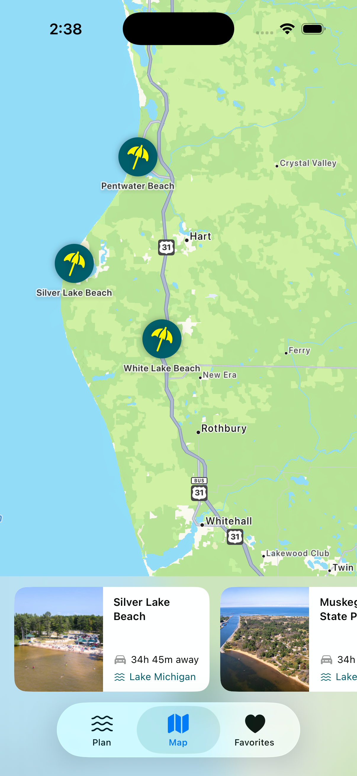 CoastCast map view with teal beach pins along Michigan's west coast and a scrollable card tray below